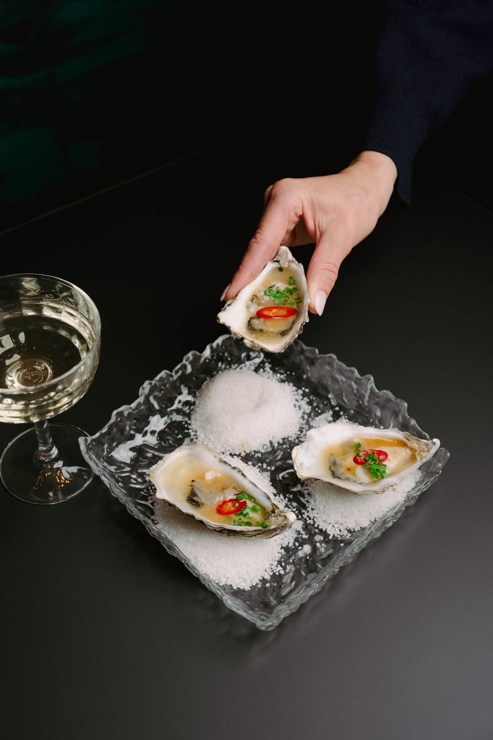 Oysters with chef's sauce at Ondori - fresh seafood delicacy